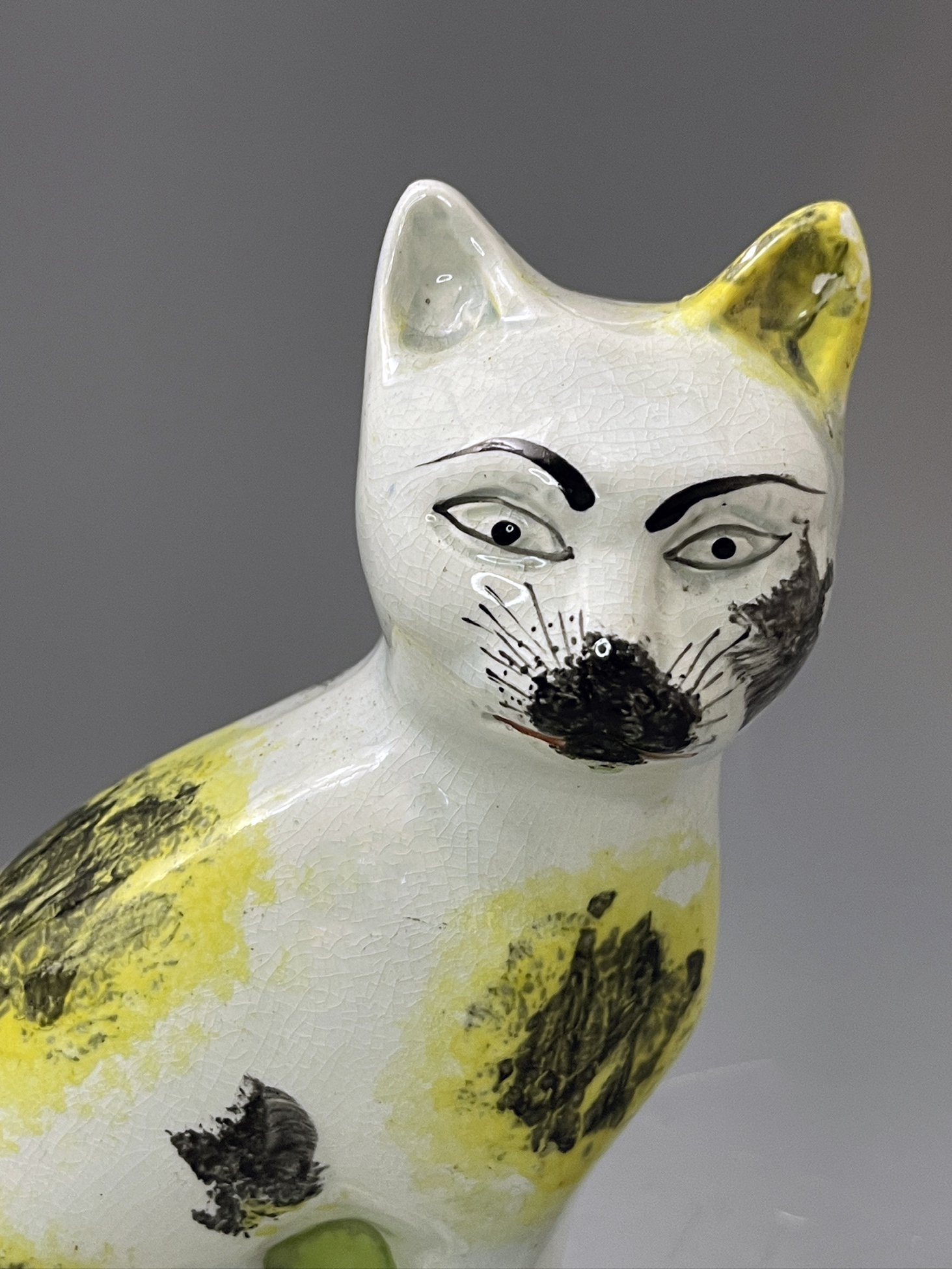 Staffordshire pottery pearlware figure of a seated cat 18th