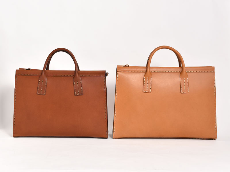 三角マチで収納量を高めたファスナー式二本手ビジネスバッグ / 革鞄の