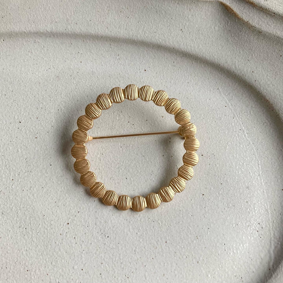 ブローチ サークルブローチ ゴールド タンバリン 卒業式 卒園式 入園式