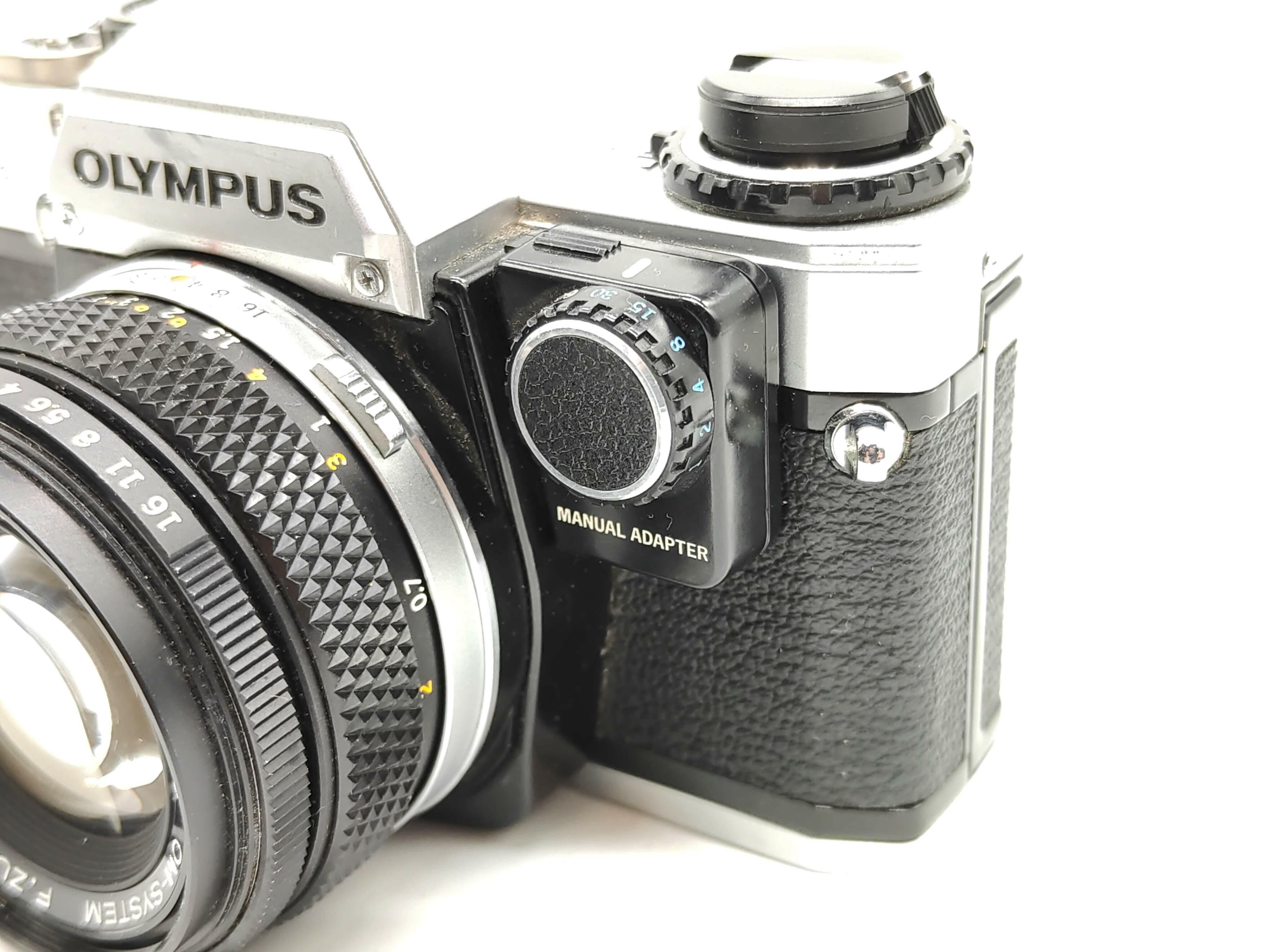 Olympus OM-10 (silver) with 50mm f/1.8 lens + MANUAL ADAPTOR