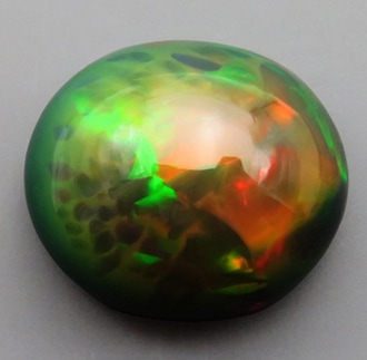 ブラックオパール (エチオピア) 5.47ct 裸石 ルース 黒の地色 緑.橙.赤