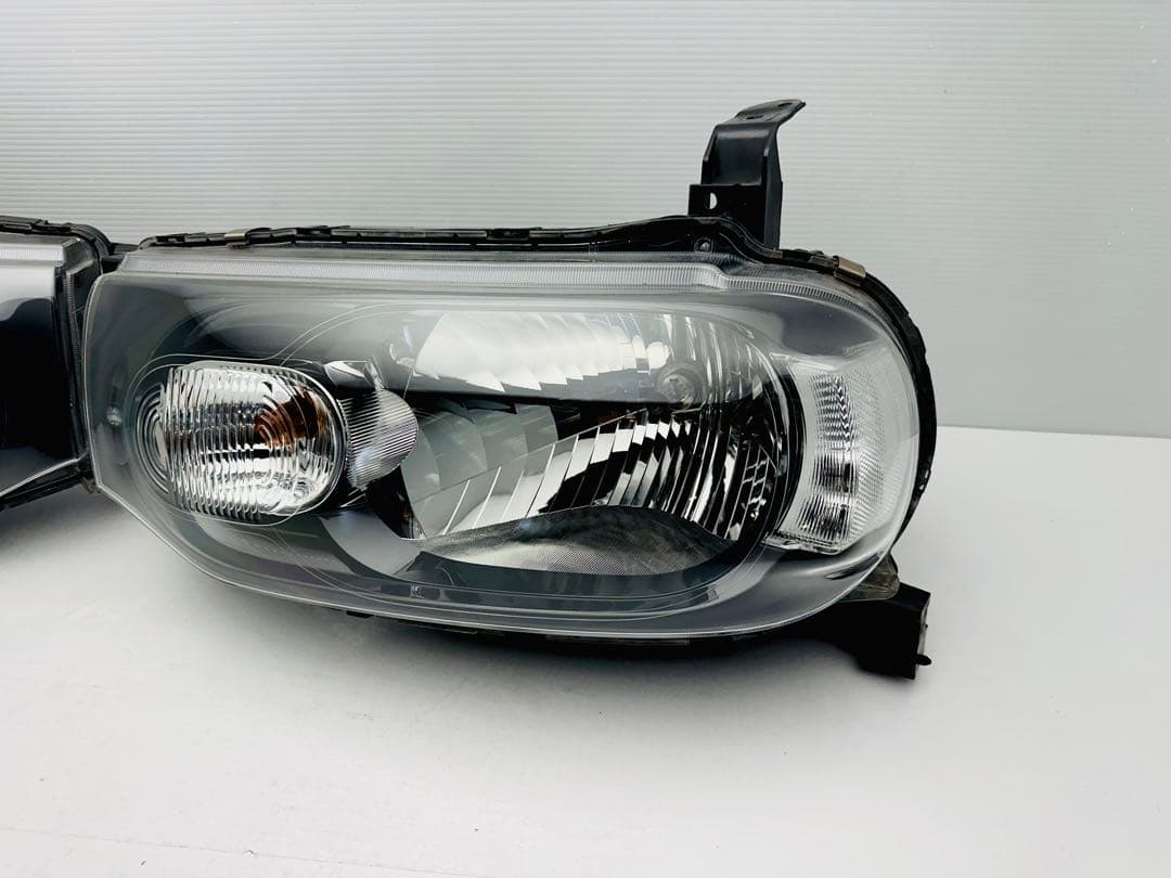 日産 キューブ ヘッドライト ヘッドランプ ハロゲン STANLEY P8190