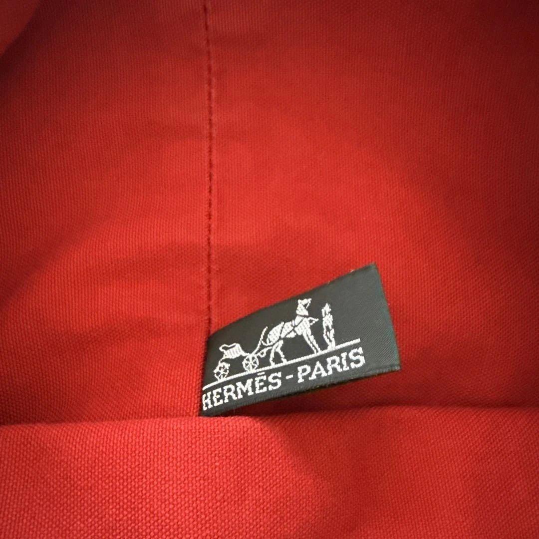 エルメス赤いキャンバスドローストリングショルダーバック