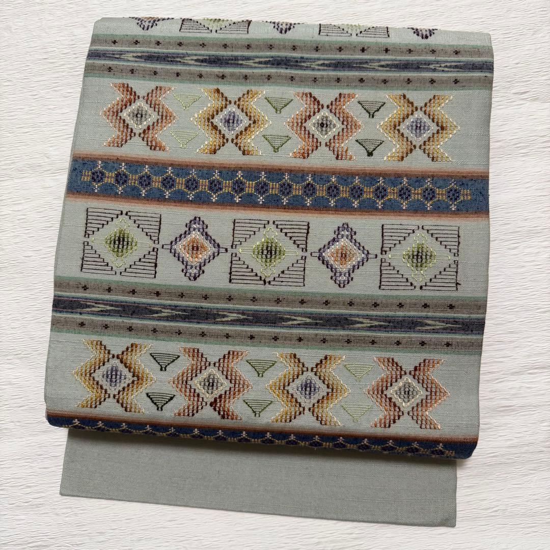 m-52 沖縄県指定無形文化財 読谷山花織 本場琉球 名古屋帯 正絹 極美品 本場琉球 読谷山花織 大城佐知子 作 “香風花” 手織り 本草木染 九寸