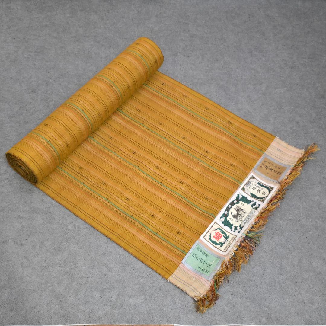 結城紬　反物　奥順　はたおり娘　手緒里　縞模様　着物 結城紬 着物 未使用 正絹 袷 奥順 はたおり娘 100亀甲 手織り 黒 波線