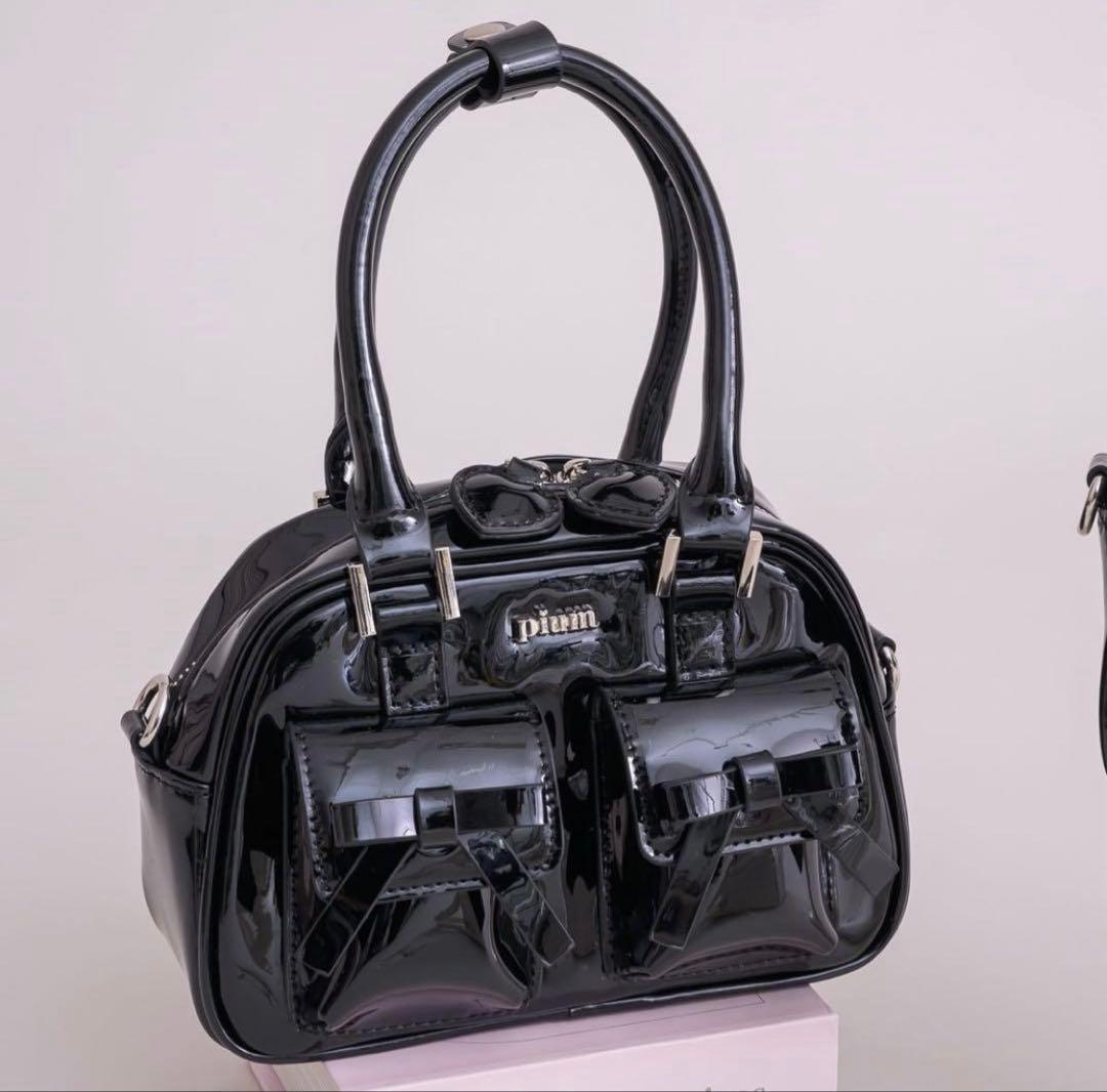 pium】リボンポケットエナメルミニボストンバッグ - メルカリ