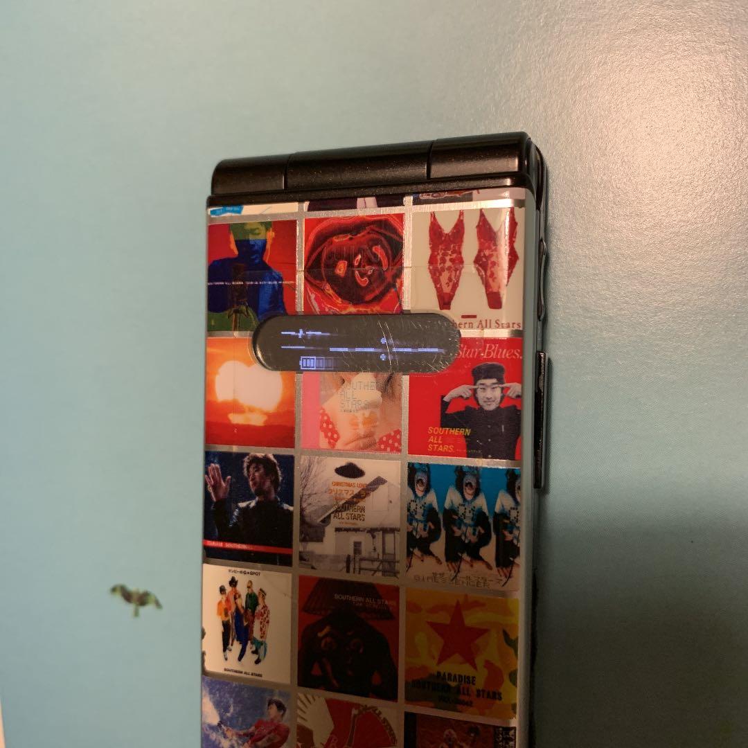 au】サザンオールスターズ 携帯電話 RE 希少 - メルカリ